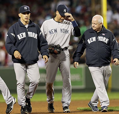 Derek Jeter limps off the field in the eighth after coming up lame while running to first base. (AP)