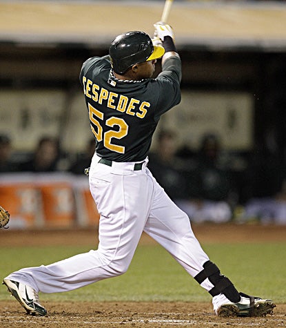 Yoenis Cespedes hits a two-run homer, helping the AL wild-card leading A's top the Orioles. (AP)