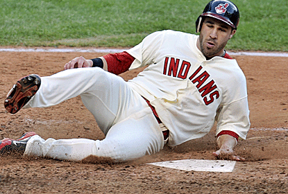 Jason Kipnis scores the tying run on a Carlos Santana triple as the Indians come back to beat the Tigers.  (US Presswire)