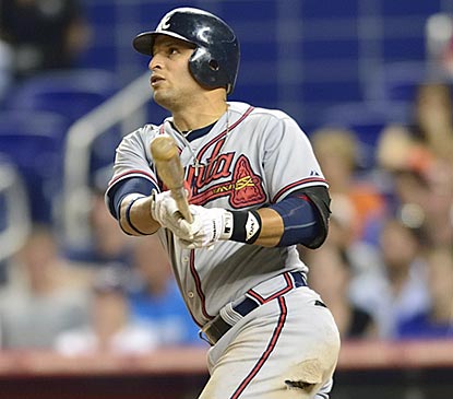 Martin Prado connects for an RBI single that gives Atlanta an insurance run in the top of the eighth inning.  (US Presswire)