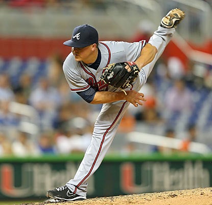 Kris Medlen yields just four hits through eight shutout innings to improve his record to 8-0 as a starter this season. (Getty Images)