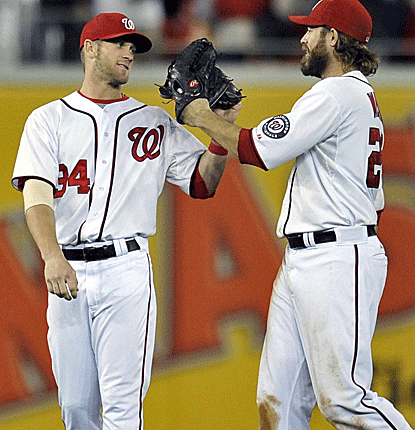 Bryce Harper and Jayson Werth are all smiles after the Nationals defeat the Dodgers to clinch a playoff spot.  (US Presswire)