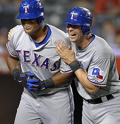Adrian Beltre (left) connects for a two-run homer in the top of the ninth to break a 1-1 tie. (AP)