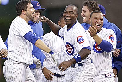 David DeJesus (left) is the hero after hitting a game-ending single in the 11th to spoil Chris Carpenter's season debut. (Getty Images)