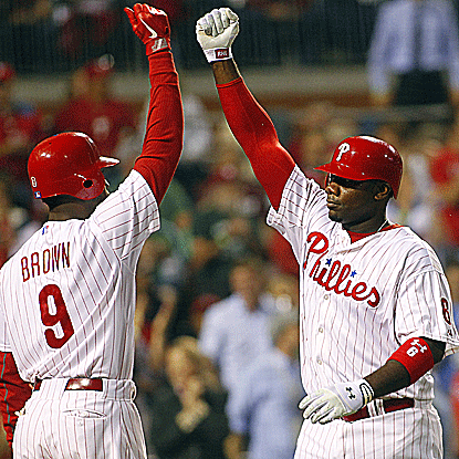 Ryan Howard (right) is congratulated following his solo home run in the Phillies' victory over the Braves.  (Getty Images)
