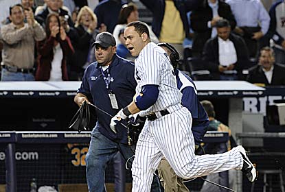 Russell Martin sends the crowd home happy with his leadoff 10th-inning homer for the Yanks, who remain atop the AL East. (AP)