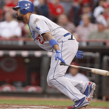 Matt Kemp delivers a bases-loaded single in the 10th that plates two runs and puts the Dodgers past the Reds. (Getty Images)