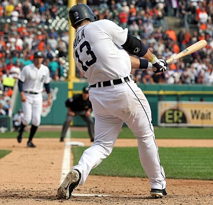 Alex Avila's fielders-choice grounder to first scores Don Kelly (background) to deliver the victory.  (Getty Images)