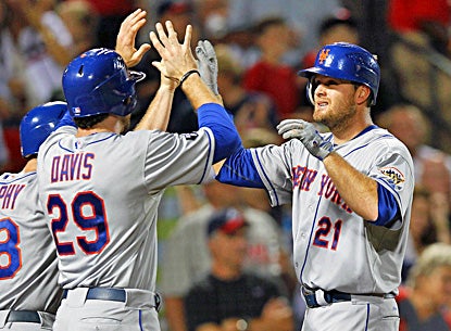 Lucas Duda (right) celebrates with Ike Davis (left) after hitting a three-run home run in the seventh inning. (AP)