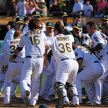 Brandon Moss' three-run homer in the bottom of the 10th inning caps the A's comeback over the Mariners.  (US Presswire)