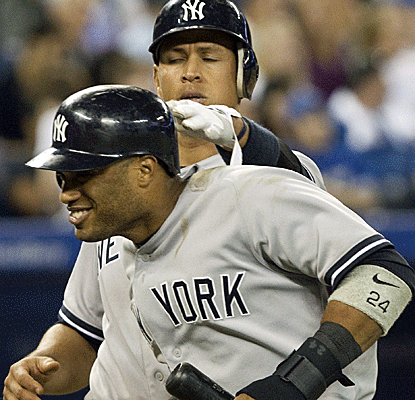 The Yankees make a late comeback when they need it most, retaining a share of the AL East lead in victory.  (AP)