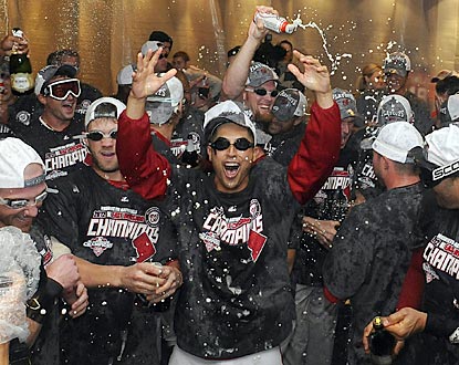 Gio Gonzalez (center) and Bryce Harper are among those celebrating the first division title in Expos/Nationals history.  (US Presswire)