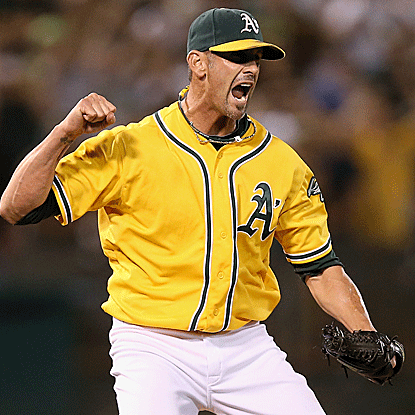 Grant Balfour nails down the save to help the A's defeat the Rangers and pull even in the AL West. (AP)