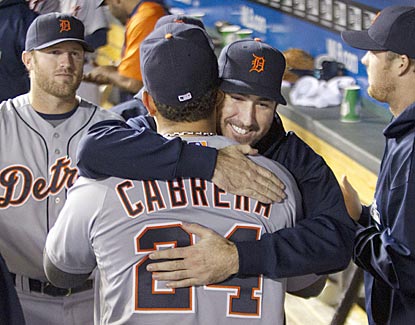 Justin Verlander embraces Miguel Cabrera after the star third baseman is pulled from the game and is assured of a Triple Crown. (AP)