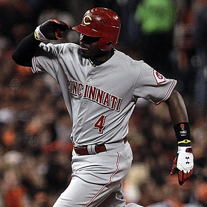 Brandon Phillips hits a two-run HR and RBI single to guide the Reds past the Giants in the opener of their Divisional Series. (US Presswire)