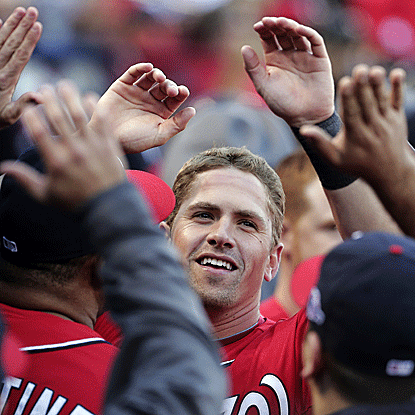 Tyler Moore delivers a pinch-hit single in the eighth inning that knocks home two runs and lifts the Nats over the Cardinals. (AP)