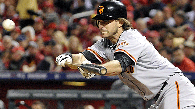 Barry Zito does it with the bat, too, driving in a run with a perfect base-hit bunt. (US Presswire)