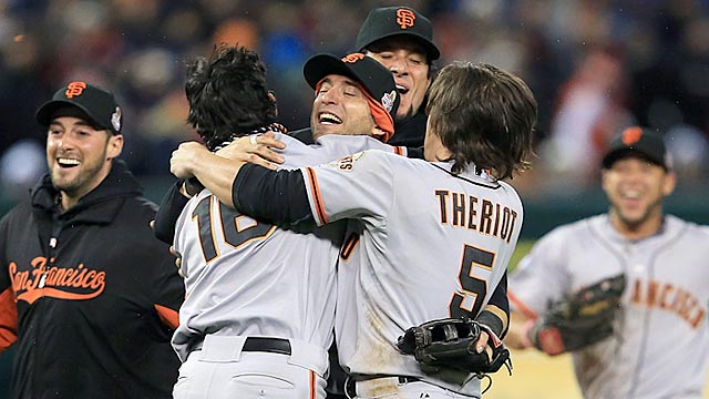Newcomer Marco Scutaro (center) gives the Giants a lift, and Ryan Theriot thrives in a new role. (Getty Images)