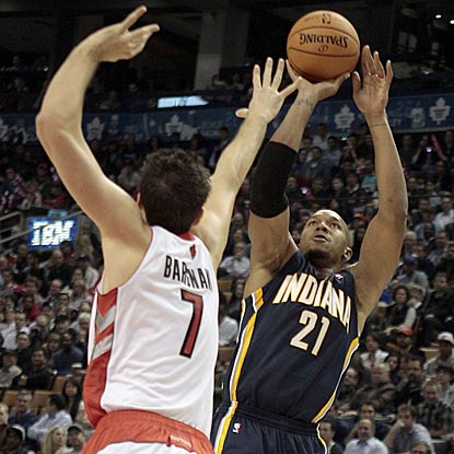 David West, shown here shooting over Andrea Bargnani, scores a game-high 25 points for the victorious Pacers.  (US Presswire)