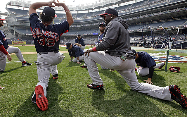 Ortiz (right) stretches out with his fellow Red Sox before Monday's game at Yankee Stadium. (Getty Images)