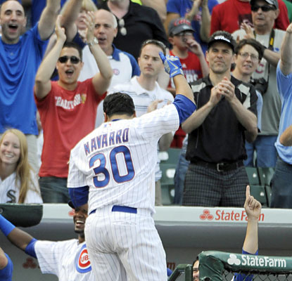 Cubs fans cheer on Dioner Navarro, who produces six RBI off a career-best three home-run outing. (USATSI)