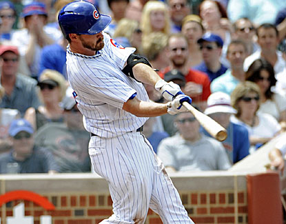 Cubs pitcher Travis Wood hits a fourth-inning grand slam off Jake Peavy and allows two runs in six innings of Chicago's win. (USATSI)