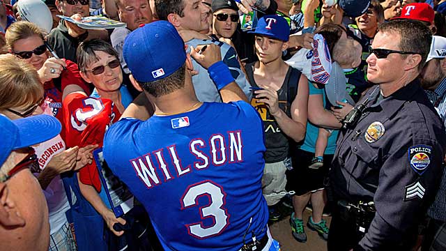 Seahawks QB Russell Wilson signs autographs at Rangers camp on Monday. (USATSI)