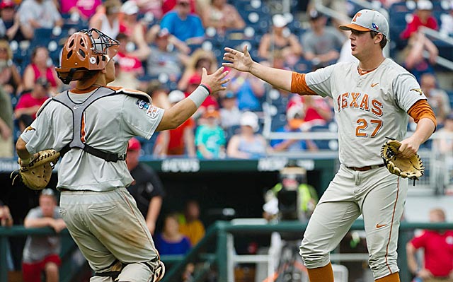 Travis Duke (right) earns congratulations from Tres Barrera after closing out the Longhorns' victory. (USATSI)
