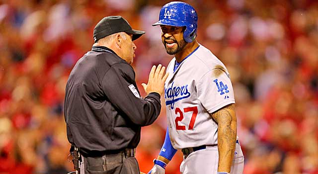 Matt Kemp has words for umpire Dale Scott after striking out. (Getty Images)