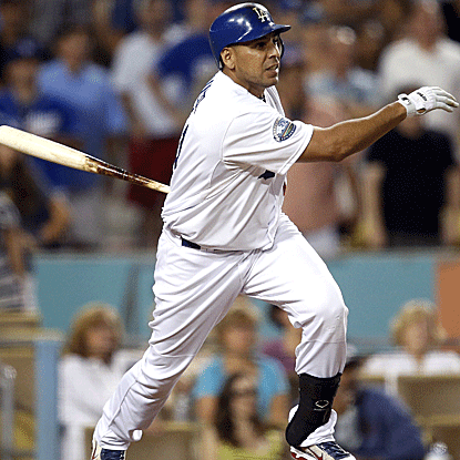 Juan Rivera delivers a pinch-hit RBI single in the bottom of the ninth inning to put the Dodgers past the Cardinals. (AP)
