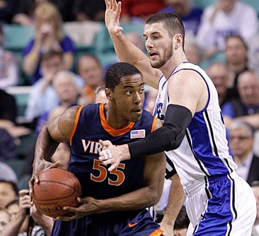 Brian Zoubek and Duke try to contain Virginia. &nbsp;(AP)