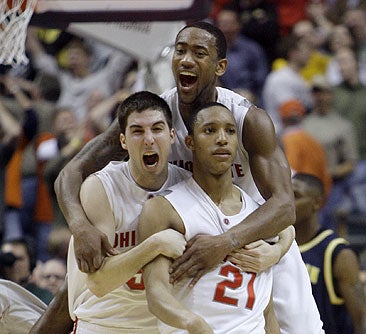Turner (right) carries the fifth-ranked Buckeyes.