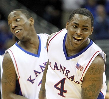 Sherron Collins (right) scores 26 to spark the Jayhawks. &nbsp;(Getty Images)