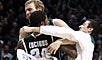 The Spartans celebrate Lucious' game-winning 3. 