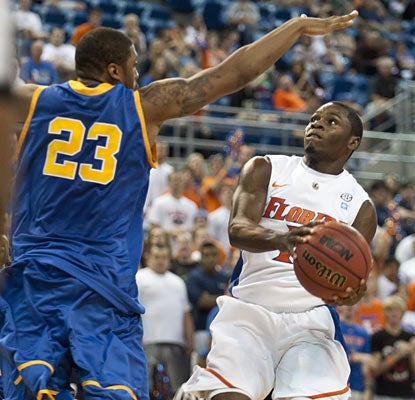 Erving Walker, who scores 16 points, helps jump-start the Gators to their third win of the season.  (AP)