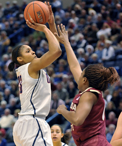 UConn's Maya Moore shoots for two points over Florida State's Chastity Clayton on her way to a career-high 41 points. (AP)