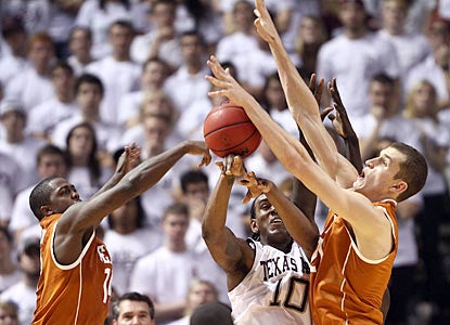 Trent Morgan (12) blocks Aggies forward David Loubeau (10) during a dominant defensive first half for the Longhorns.  (US Presswire)