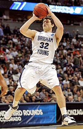 Jimmer Fredette's ability to get shots off at all angles entices NBA scouts. (Getty Images)