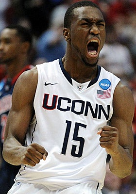 Kemba Walker celebrates as UConn continues its undefeated postseason run with a win over Arizona. (Getty Images)