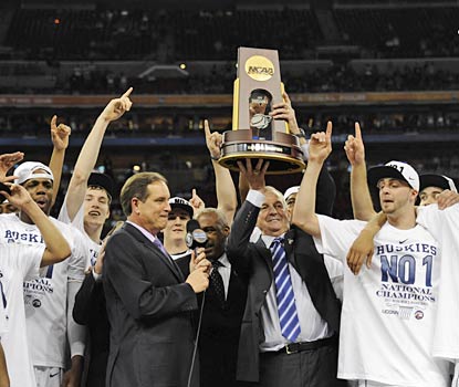 Jim Calhoun raises his third national championship trophy, his first since 2004.  (US Presswire)