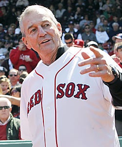 Jim Calhoun, who says he is unclear of his future, knows what to do at Fenway as he throws out the ceremonial first pitch. (AP)