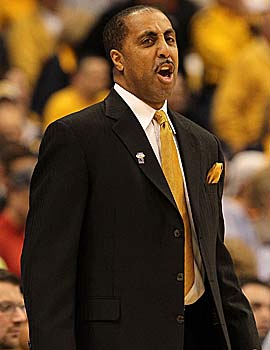 Washington coach Lorenzo Romar can't be happy about what led to his assistant being assessed the violation. (Getty Images)