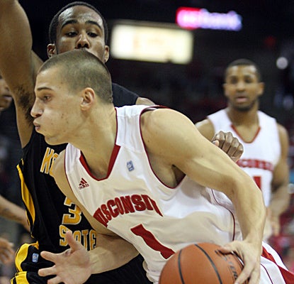 Ben Brust drives to the hoops on his way to 14 points as Wisconsin throttles Kennesaw State. (US Presswire)