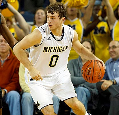 Zack Novak adds layups to help Michigan get a large lead early in the game to crush Towson. (US Presswire)