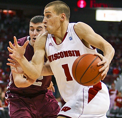 No. 14 Wisconsin's Ben Brust drives past Colgate to score a career-high 17 points to lead all scorers.  (AP)