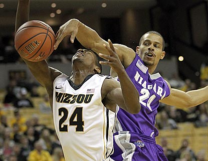Kim English recovers from this foul by Ali Langford in the first half to score 14 points for Missouri.  (Getty Images)
