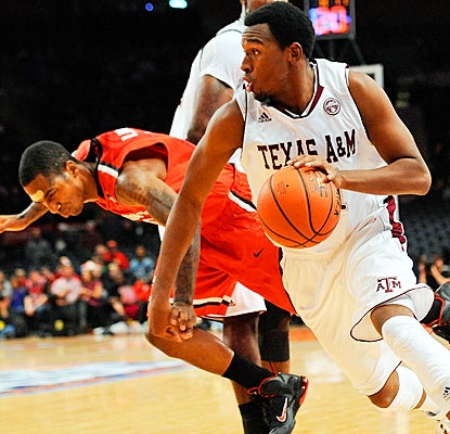 Texas A&M's Elston Turner drives to the basket for two of his eight points against St. John's.  (Getty Images)