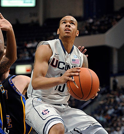 Shabazz Napier records 22 points, 13 dimes and 12 rebounds for the ninth triple-double in UConn history. (AP)