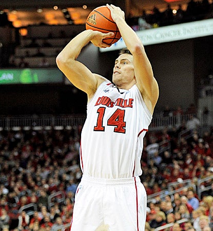 The Cardinals' Kyle Kuric scores 12 points in Louisville's win over the Arkansas State Red Wolves. (US Presswire)