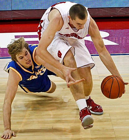 Wisconsin's Jared Berggren (right) earns a career-high 21 points against Missouri-Kansas City. (AP)